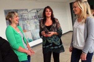 Eleanor McEvoy, who recently formed a new company called Budget Energy, talking with students Rachel Collins and Stephanie Morrison.