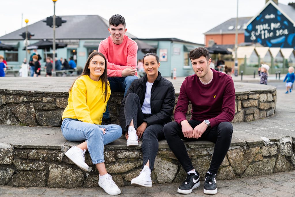 Students sitting by the sea, Strandhill, Sligo