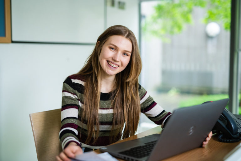 A student studying on her laptop